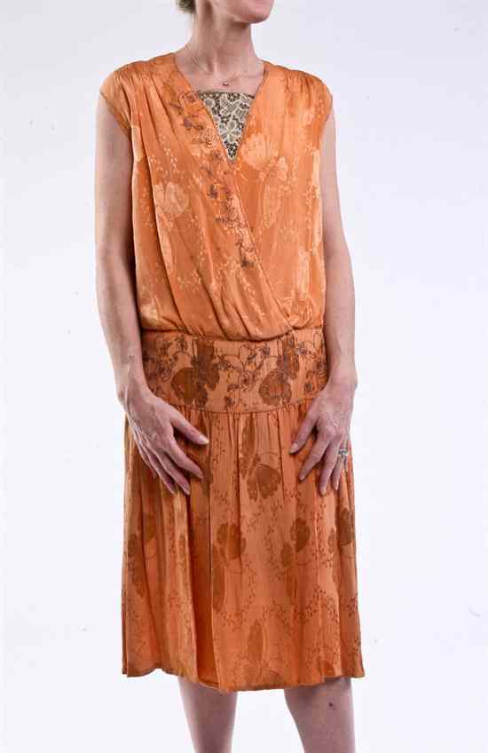 Appraisal: EMBROIDERED AND BEADED PEACH SILK FLAPPER DRESS s Delicately embroidered