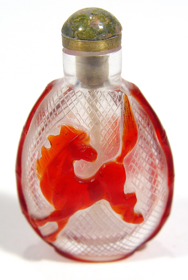 Appraisal: Chinese red overlay glass snuff bottle with moulded horse decoration