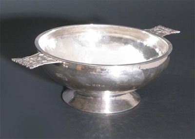 Appraisal: An A E Jones silver quaiche model no footed form