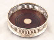 Appraisal: A modern sterling silver wine coaster with pierced gallery and