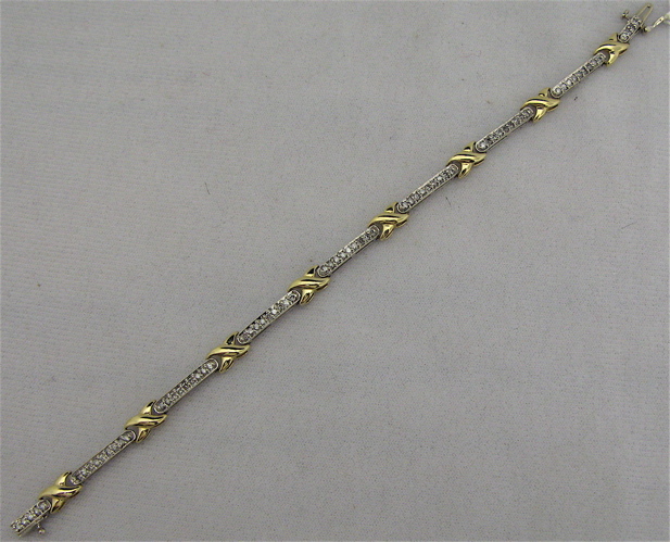 Appraisal: DIAMOND AND TEN KARAT WHITE AND YELLOW GOLD BRACELET -