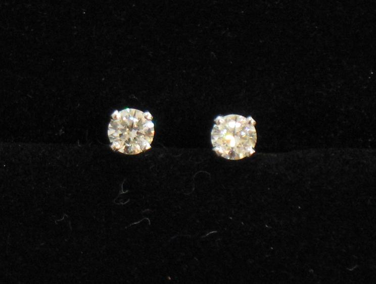 Appraisal: A PAIR OF MODERN DIAMOND SOLITAIRE EAR STUDS each round