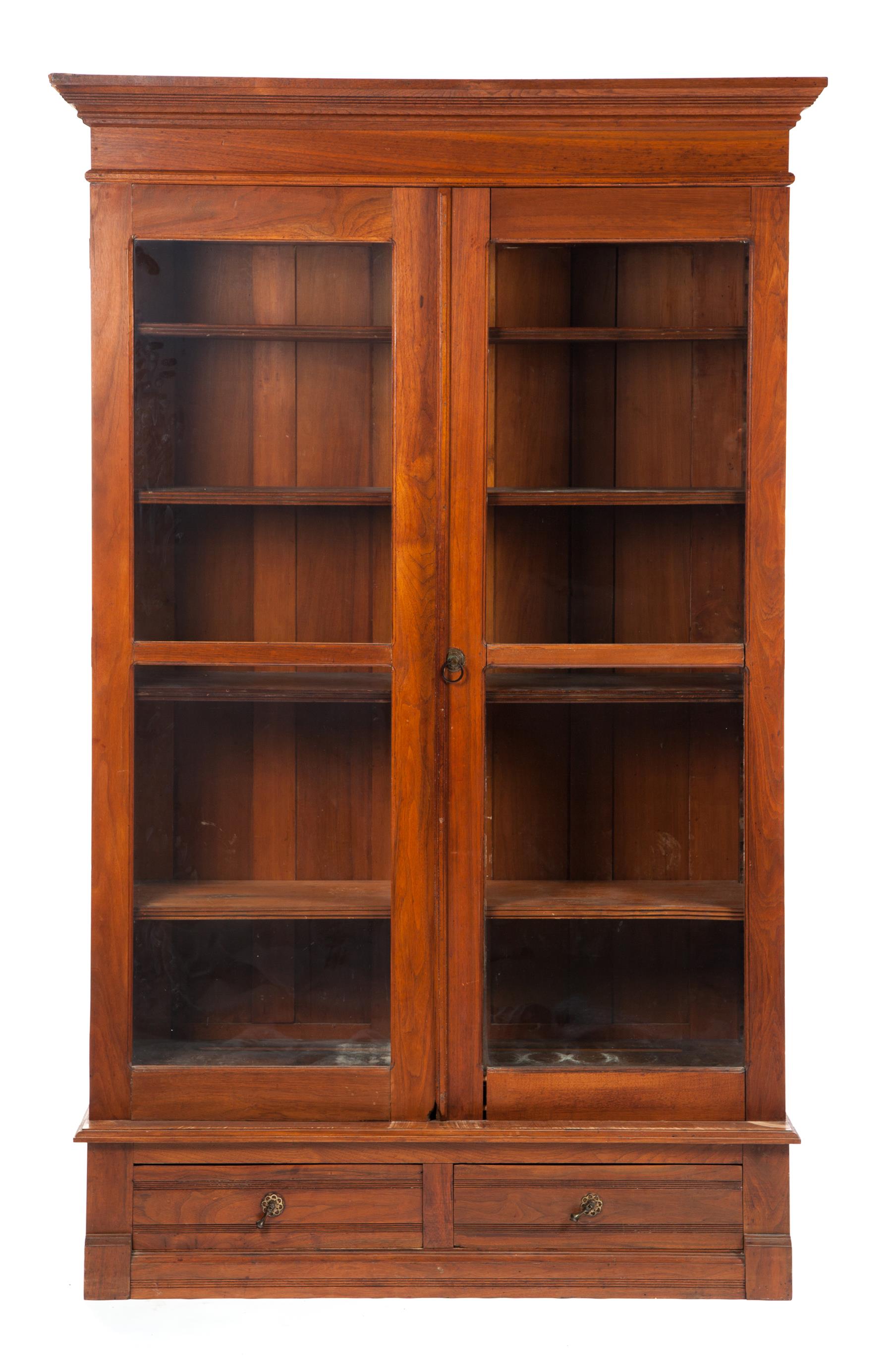 Appraisal: THREE-PIECE TWO-DOOR LIBRARY BOOKCASE American ca Molded cornice two two-pane