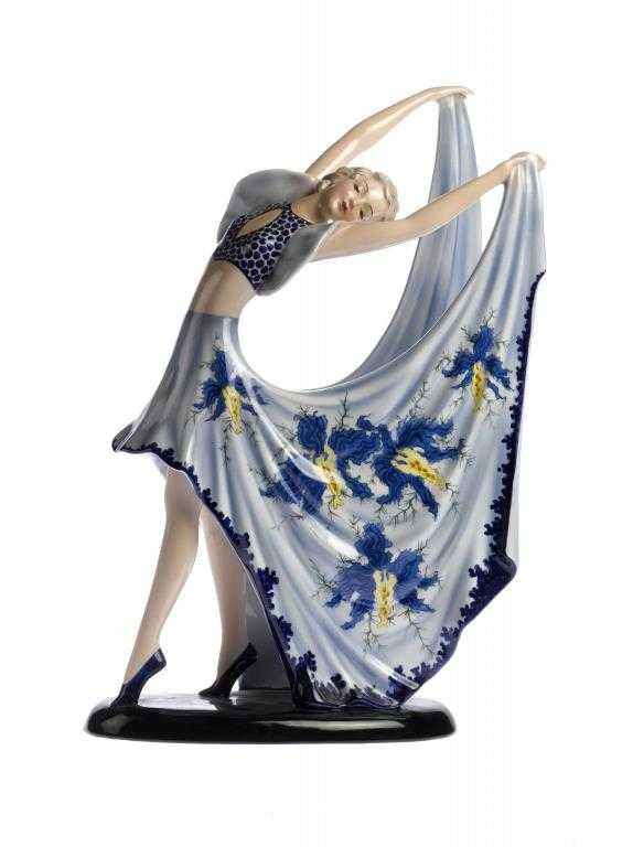 Appraisal: A GOLDSCHEIDER EARTHENWARE FIGURE OF A DANCER in winged blue