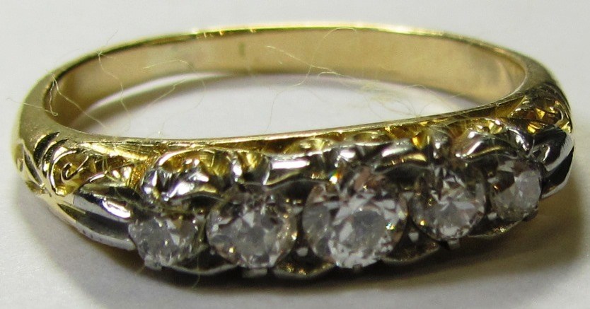 Appraisal: A gold and diamond set five stone ring mounted with