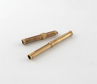 Appraisal: A nine carat gold slide action pen and pencil by