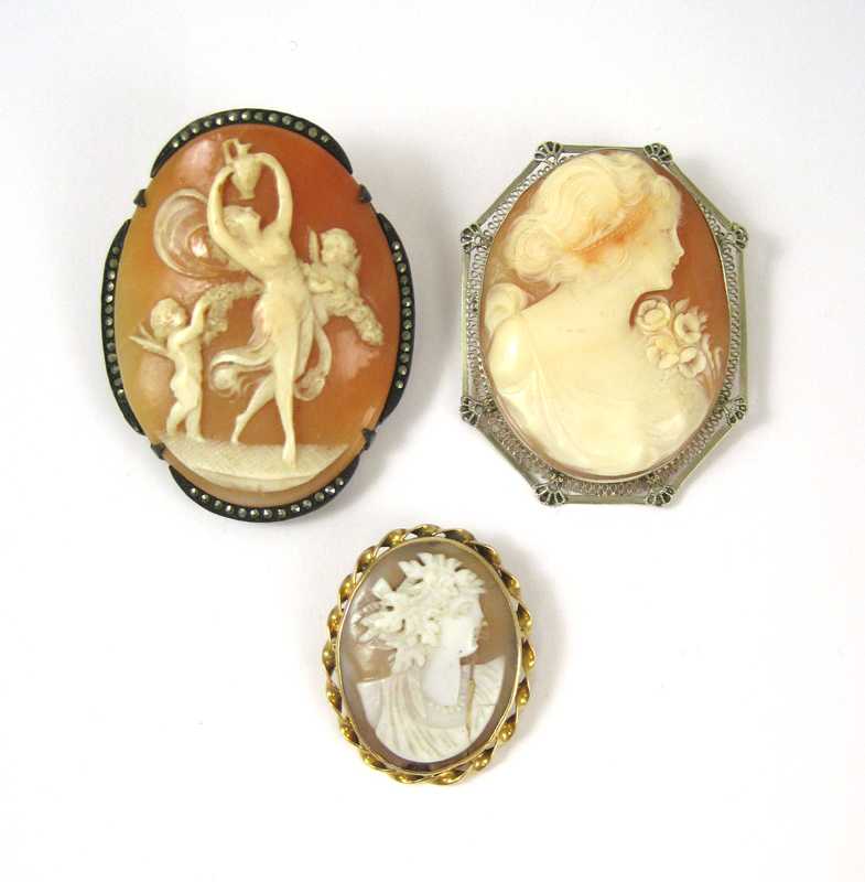 Appraisal: THREE VICTORIAN CAMEO BROOCHES including pendant brooch cameo portrait of