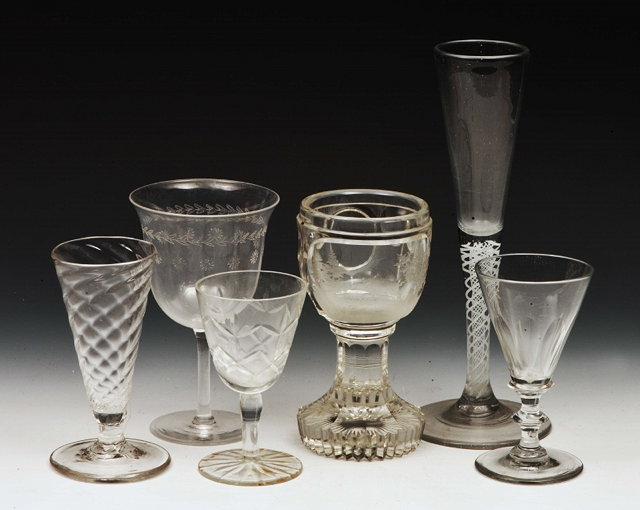 Appraisal: A GROUP OF SIX DRINKING GLASSES to include a tall