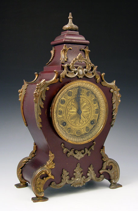 Appraisal: WATERBURY LOUIS CAST IRON MANTLE CLOCK Red painted cast iron