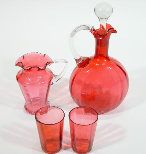 Appraisal: Victorian cranberry glass ewer and stopper a cranberry glass jug