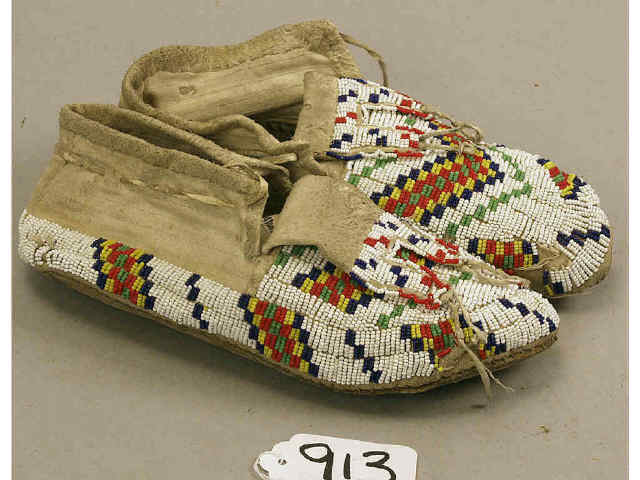 Appraisal: Old Plains fully beaded moccasins on white background with multi-color