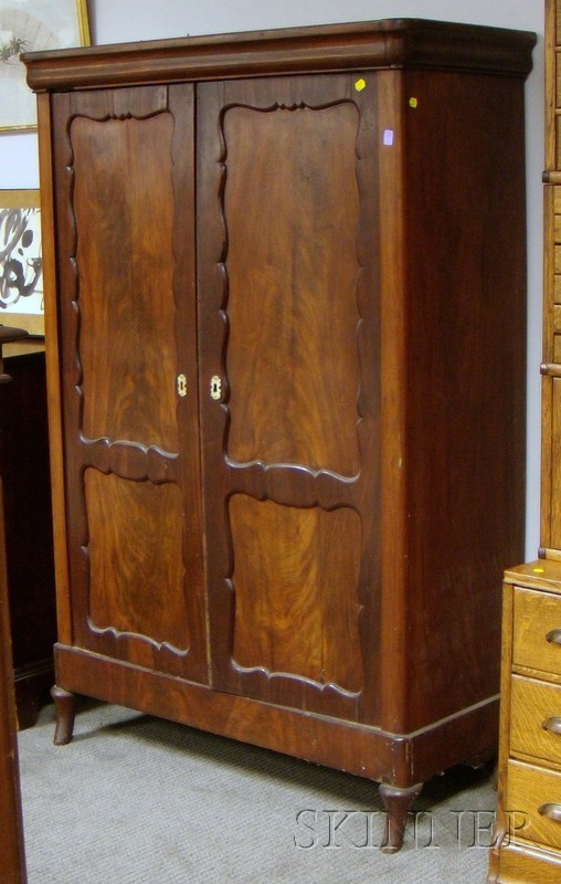 Appraisal: Empire Rosewood and Mahogany Two-Door Cabinet the interior with three