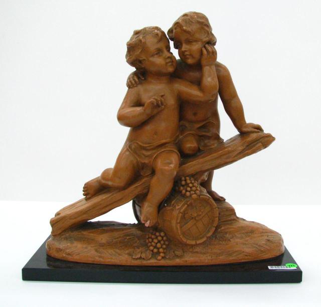 Appraisal: Vintage terra cotta statue depicting two Putti on a barrel