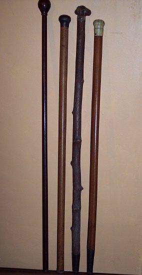 Appraisal: A walking stick with ivory knob handle and three others