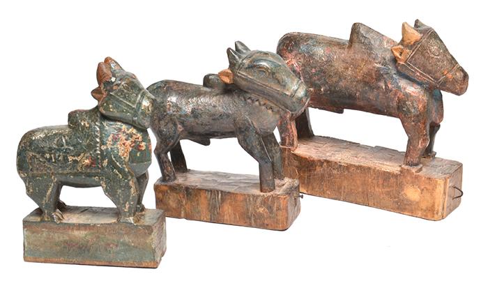 Appraisal: THREE MOROCCAN CARVED BULLOCKS