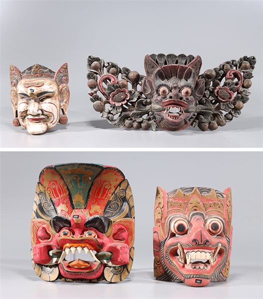 Appraisal: Group of four painted elaborate Indonesian masks largest H x