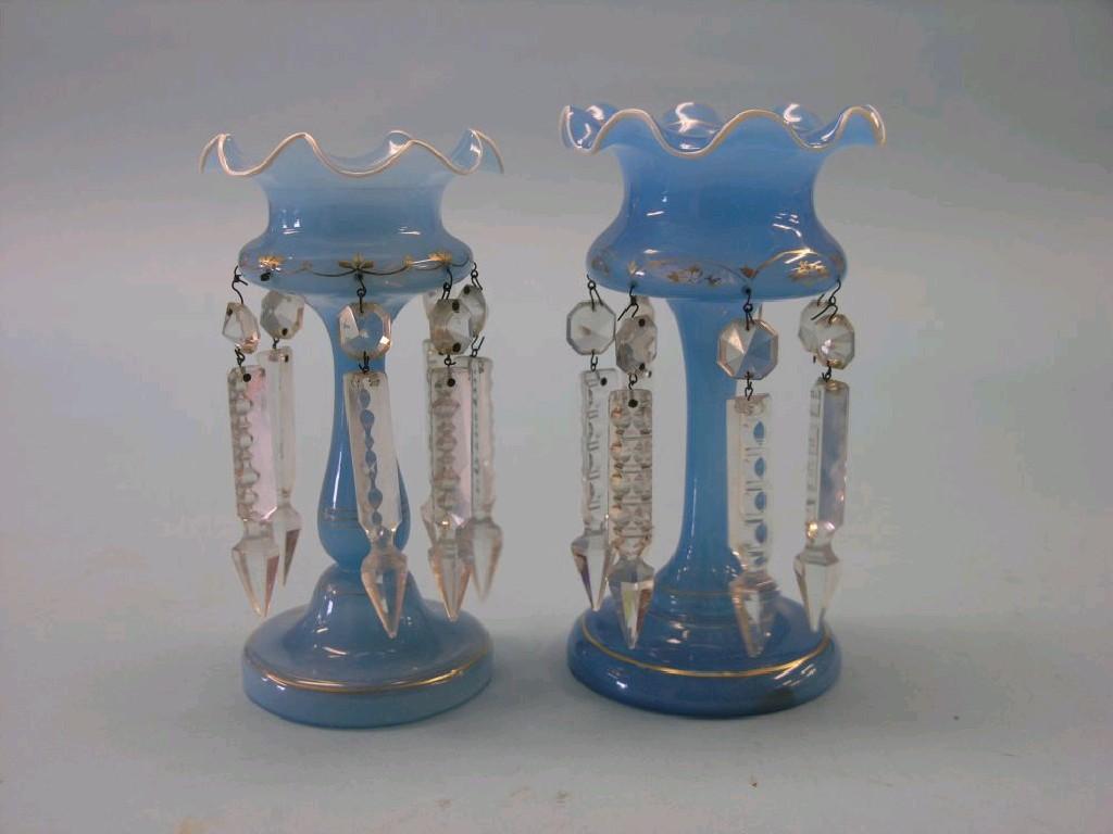 Appraisal: A pair of Victorian blue glass table lustres in together