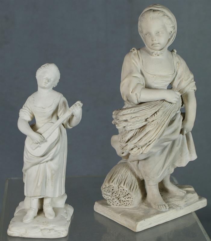 Appraisal: terre-de-pipe figurines girl playing a guitar and a harvester tallest