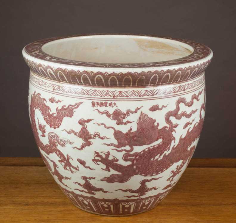 Appraisal: CHINESE PORCELAIN MING STYLE JARDINIERE with the iron red dragon