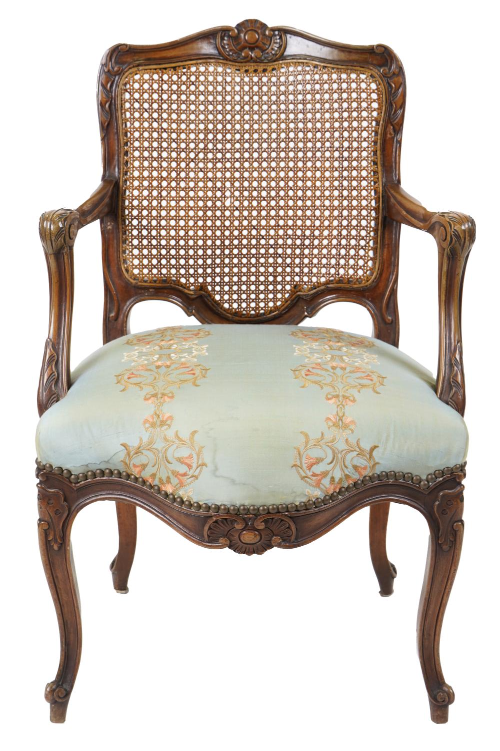 Appraisal: FRENCH PROVINCIAL CARVED WOOD FAUTEUIL th century with caned back