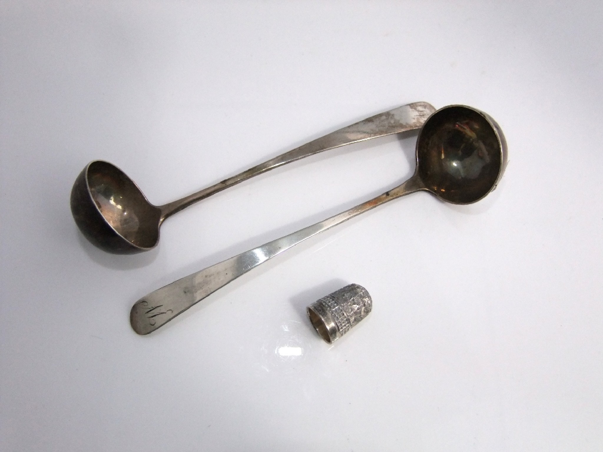 Appraisal: Two Scottish silver Old English pattern sauce ladles Edinburgh probably