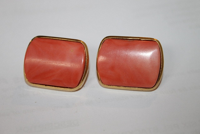 Appraisal: A PAIR OF CT GOLD AND CORAL EARRINGS of curved