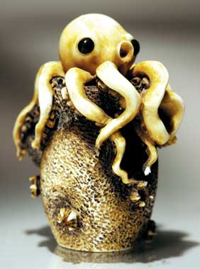 Appraisal: CARVED IVORY NETSUKE Amusing carved ivory netsuke of an octopus