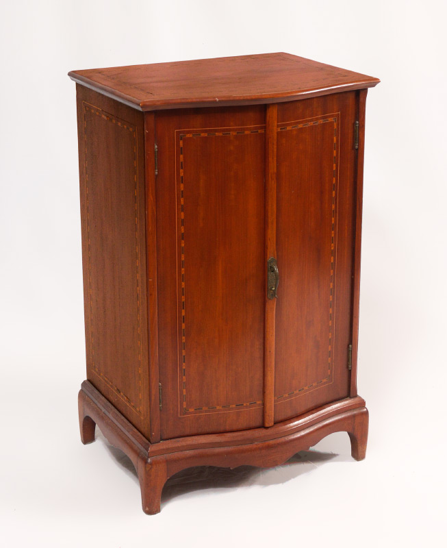 Appraisal: INLAID BOWFRONT MUSIC CABINET Bowfront top and mechanical doors with