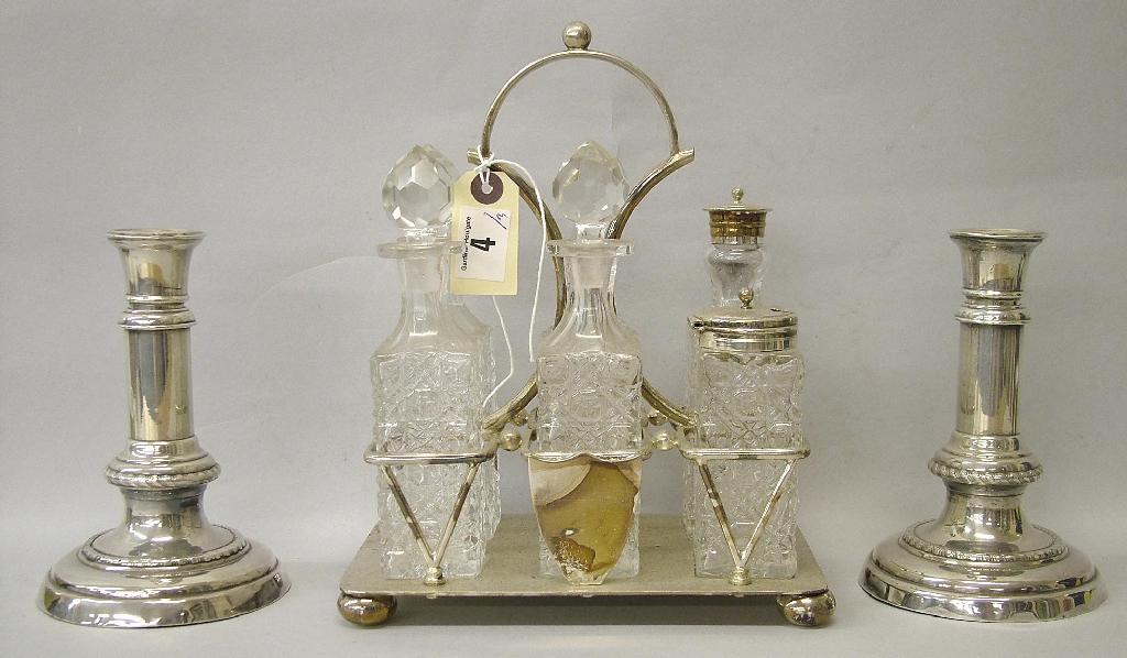 Appraisal: Six bottle cruet with plain rectangular stand contains one different