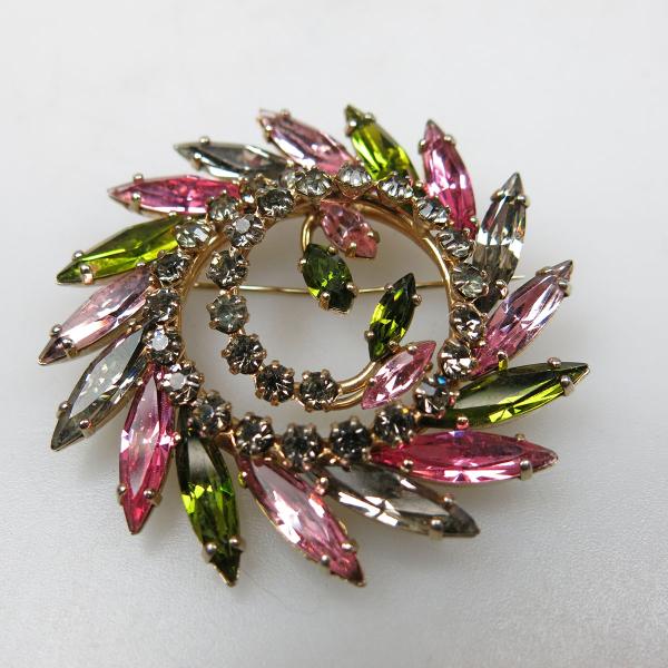 Appraisal: Sherman Gold Tone Metal Swirl Brooch set with clear pink