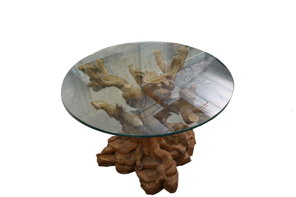 Appraisal: TREE TRUNK-FORM CARVED WOOD CENTER TABLEwith a glass top inches