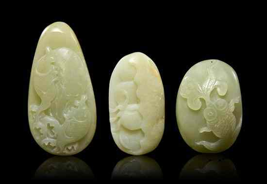 Appraisal: A Group of Three Carved Jade Pebbles of celadon colored