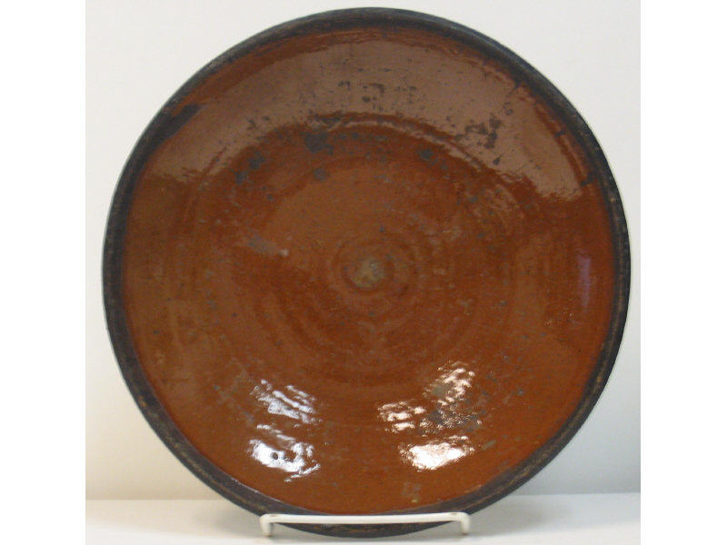 Appraisal: FOUR AMERICAN REDWARE PLATES Diameters inch inches inch and a