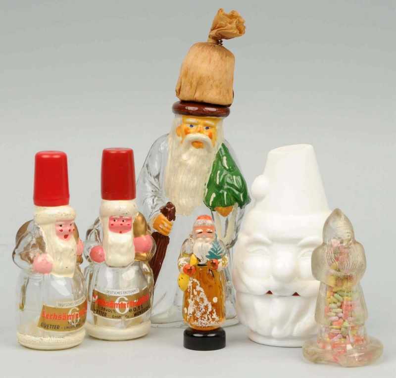 Appraisal: Lot of Glass Santa Bottles Description One Santa contains original