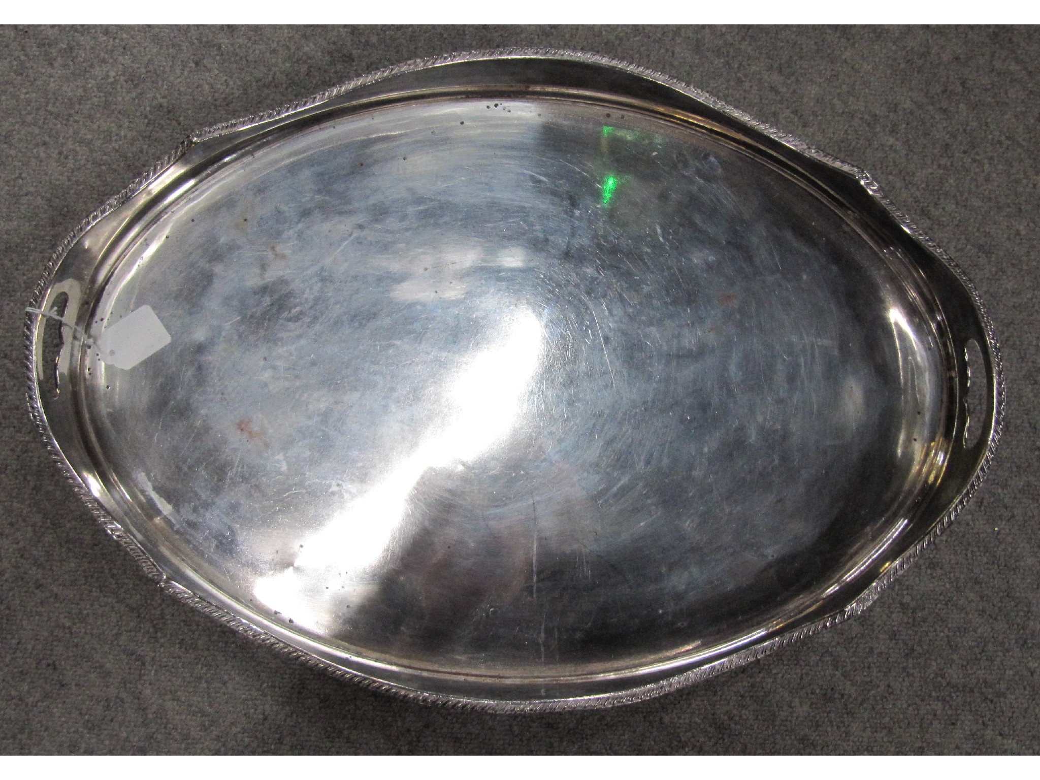 Appraisal: A silver plated double handled serving tray