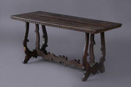 Appraisal: ITALIAN BAROQUE WALNUT SMALL CENTER TABLE The -plank overhang top