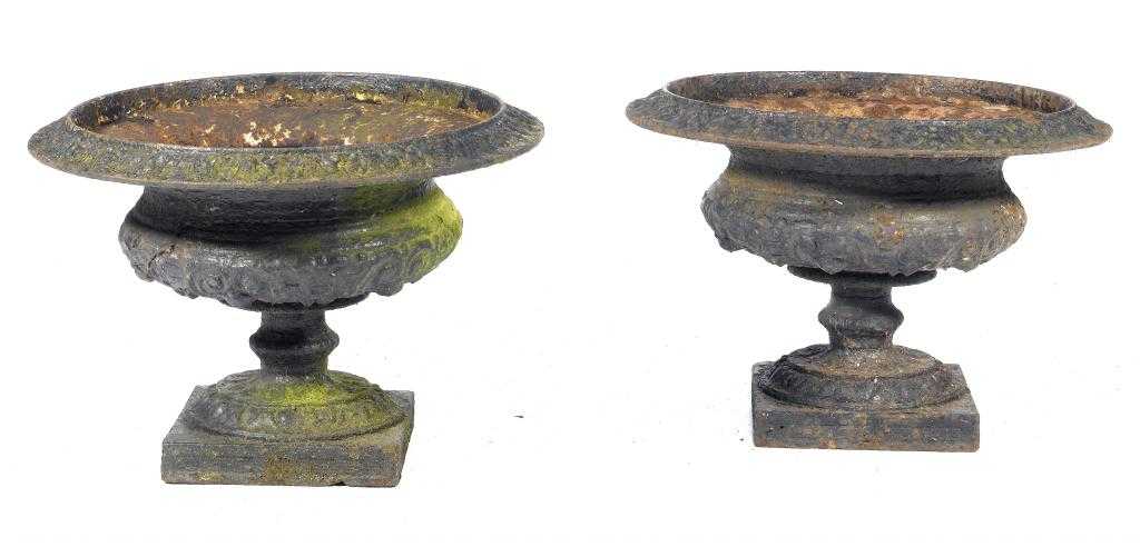 Appraisal: A PAIR OF VICTORIAN CAST IRON GARDEN VASES of campana