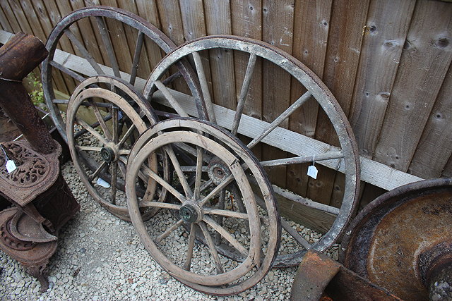 Appraisal: A PAIR OF TH CENTURY IRON BOUND WOODEN WHEELS from