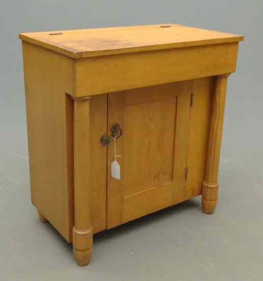 Appraisal: th c lift top single door Empire country pine server