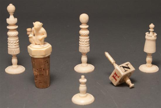 Appraisal: Continental carved ivory figural decanter stopper spinning top and three