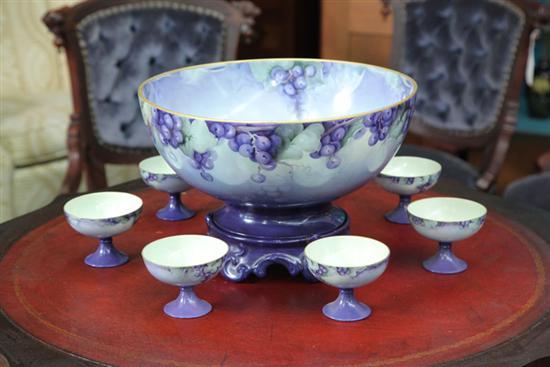 Appraisal: PORCELAIN PUNCH BOWL AND CUPS A handpainted punch bowl on