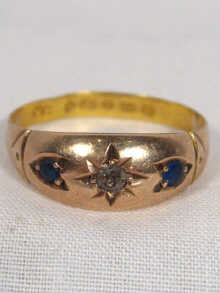 Appraisal: A sapphire and diamond gold ring with a replaced gold