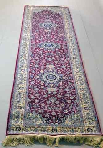 Appraisal: A FINE HAND-MADE WOOL PERSIAN RUNNERRaspberry field with three floral