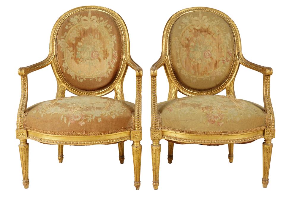 Appraisal: PAIR OF LOUIS XVI STYLE GILTWOOD FAUTEUILS th century with