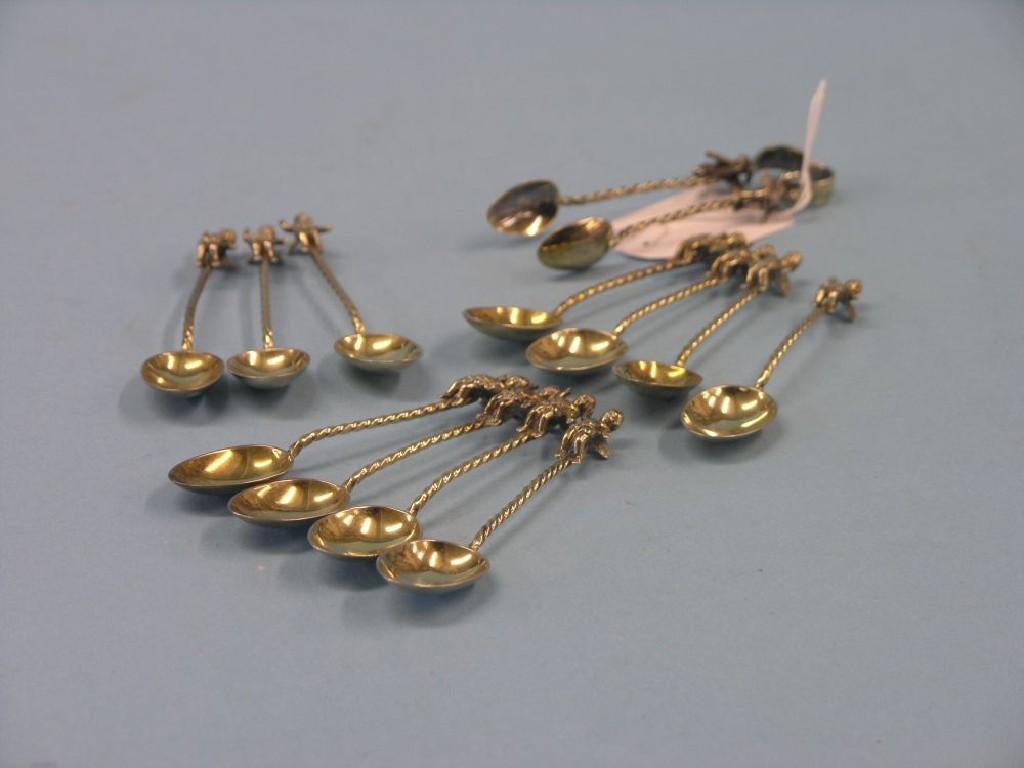 Appraisal: A part-set of eleven silver-gilt coffee spoons with matching tongs