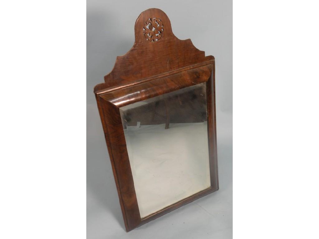 Appraisal: A mid thC walnut cushion shaped dressing mirror wall mirror