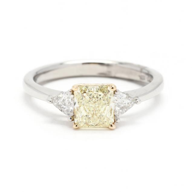 Appraisal: GOLD AND PLATINUM DIAMOND RING Centering on a radiant cut