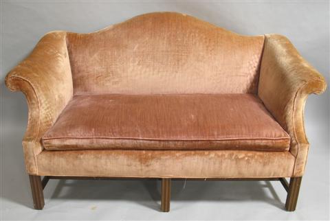 Appraisal: CHIPPENDALE STYLE CAMEL BACK SETTEE The shaped padded back over