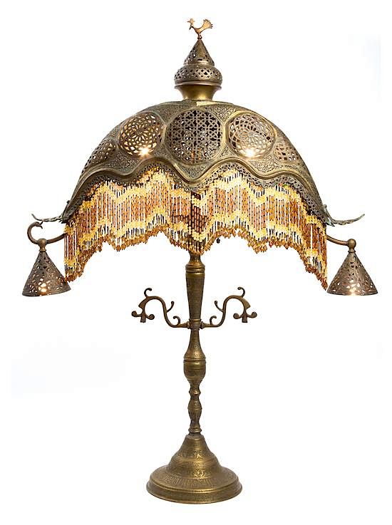 Appraisal: A Turkish or Egyptian Pierced Brass Table Lamp Height inches