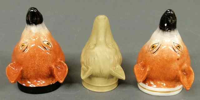 Appraisal: Three English ceramic fox head stirrup cups tallest h